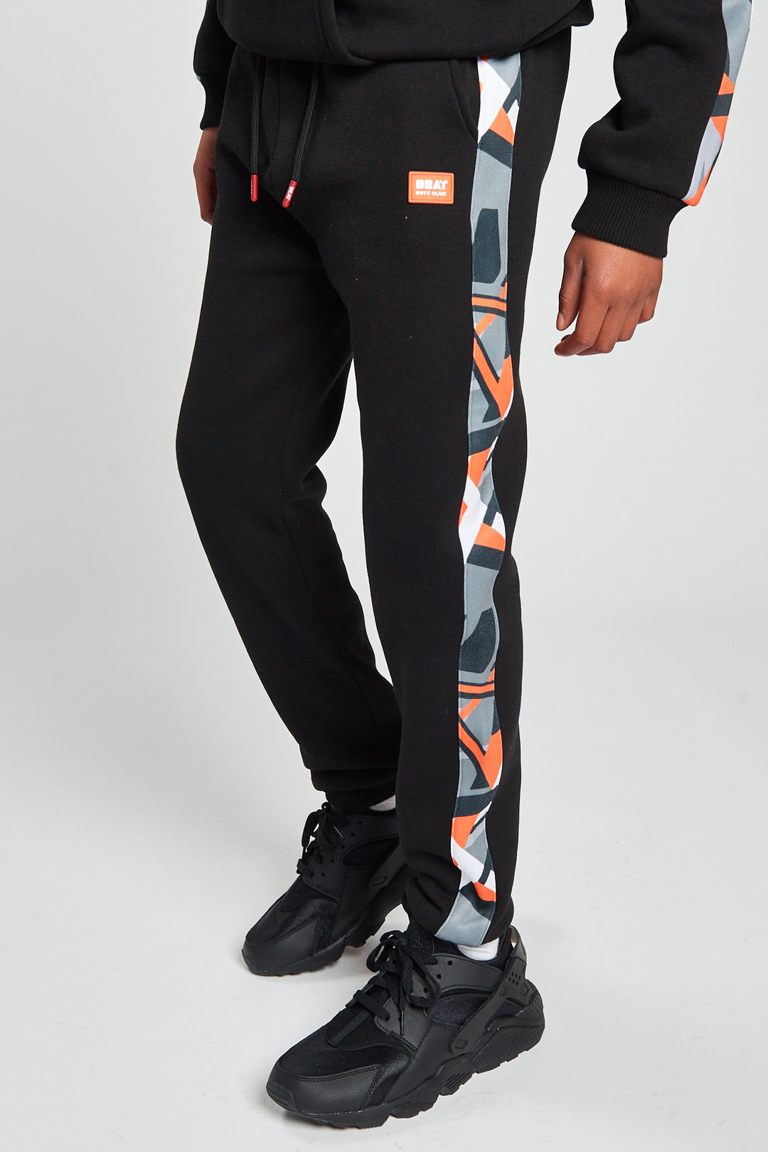 Orange camo track pants on sale